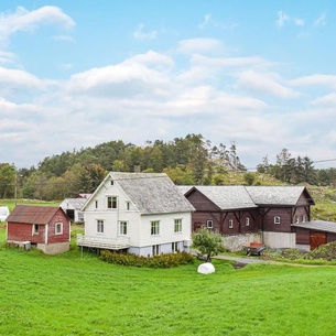 Cottage on farm in rural environment.