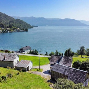 Enjoy a relaxing vacation on a former farm by the glistening Hardangerfjord.