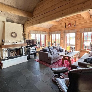 Experience peace and nature in a holiday home with mountain views and sauna.