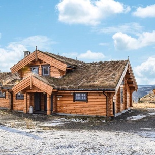 Get ready for an active vacation in a unique hut with a vegetation roof and natural furnishings.