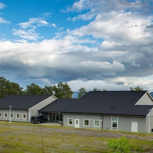 Hostel in a rural area surrounded by mountains and fjord