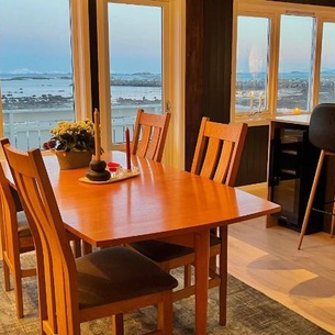 House by the ocean with midnight sun view