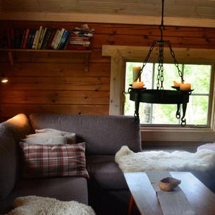 Log cabin with annex and boathouse