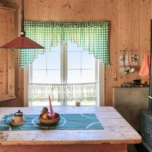 Look forward to a fulfilling vacation in this Norwegian cottage overlooking the valley.