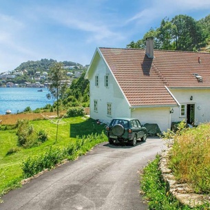 This large and classic vacation home welcomes you with a beautiful fjord view.